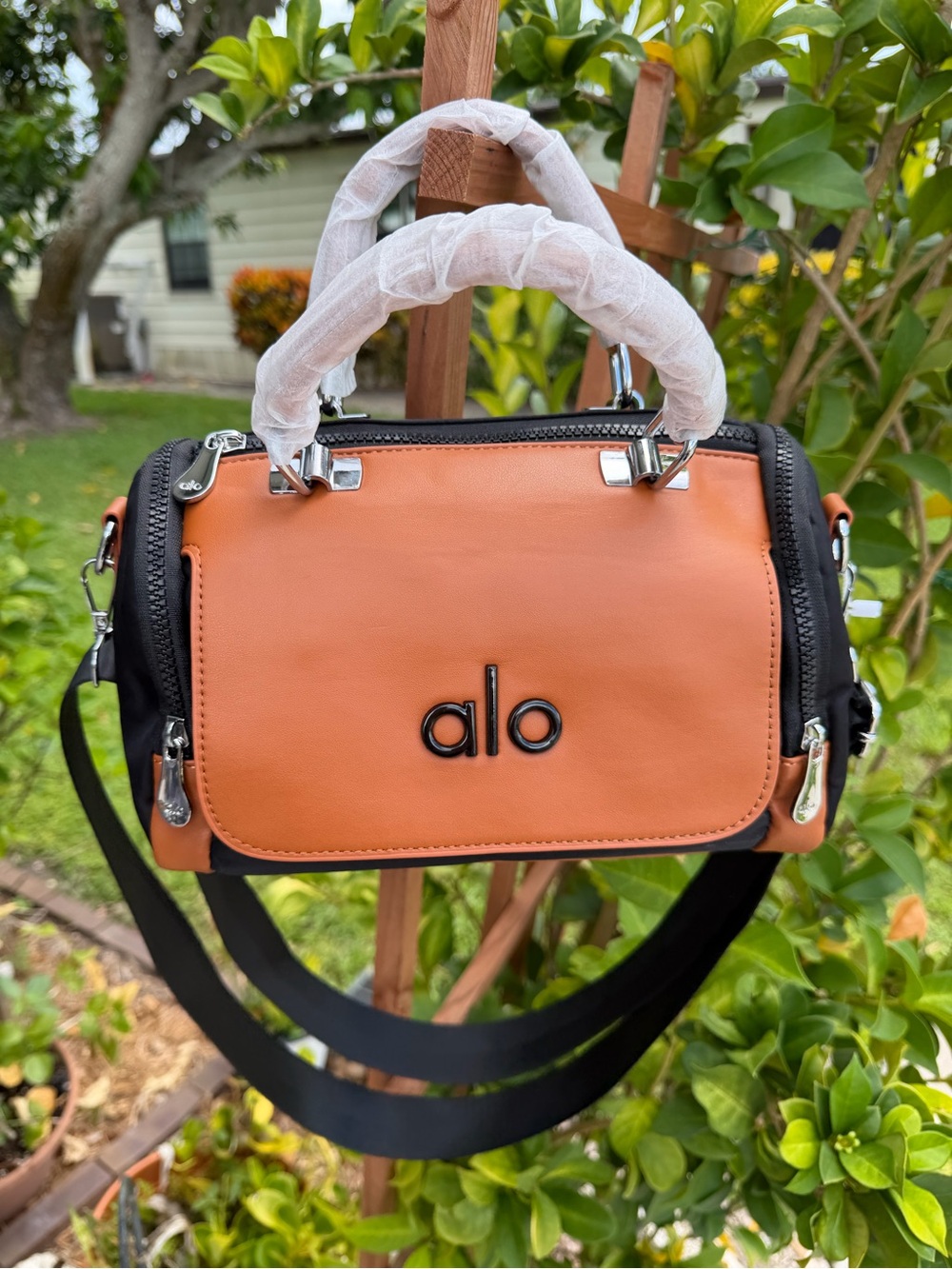 ALO Yoga Orange and Black Leather Crossbody Satchel